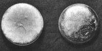 Plutonium pictured against an inch and centimeter rule.